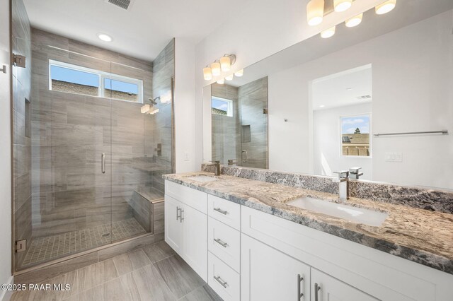 7480 E Louie Ln, Prescott Valley, AZ 86315 - bathroom with a sink, a stall shower, and a healthy amount of sunlight