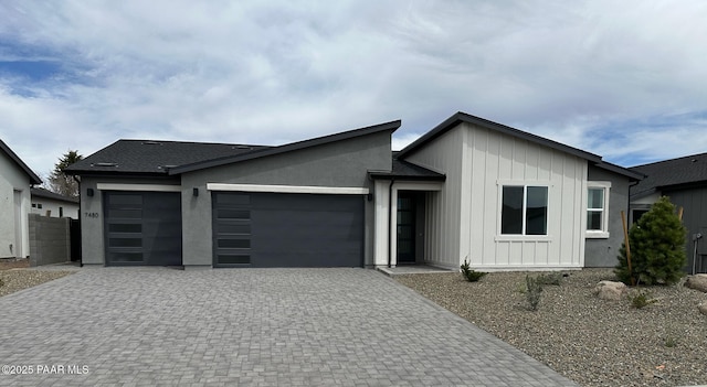 7480 E Louie Ln, Prescott Valley, AZ 86315 - view of front of house with board and batten siding, decorative driveway, and a garage