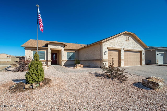 ranch-style house featuring a garage