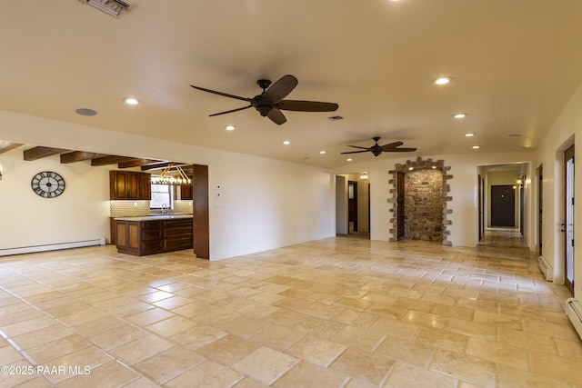 unfurnished living room featuring recessed lighting, stone tile flooring, a baseboard heating unit, visible vents, and ceiling fan