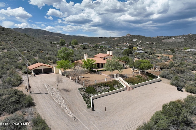 birds eye view of property featuring a mountain view
