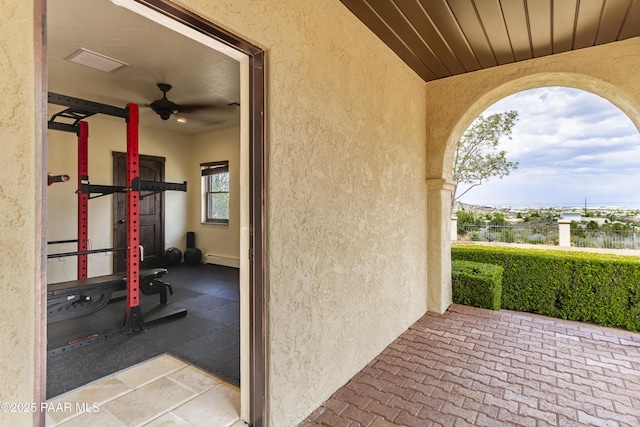 view of patio / terrace with a baseboard radiator and visible vents