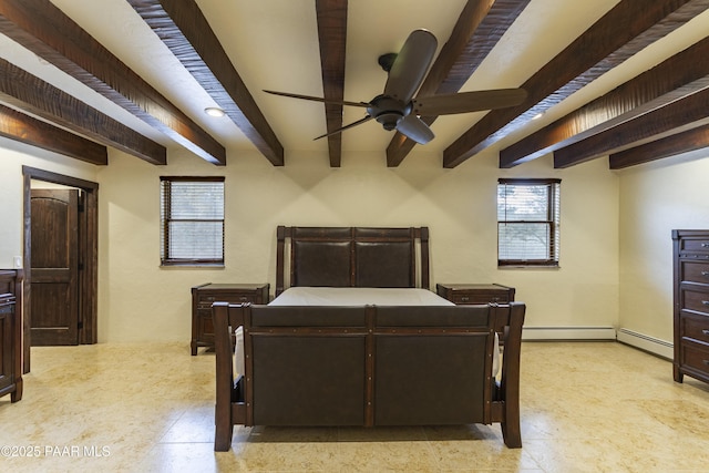 bedroom with beam ceiling and a baseboard heating unit