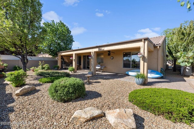 1109 N Half Hitch Rd, Prescott Valley, AZ 86314 - back of property with stucco siding, a patio area, and ceiling fan