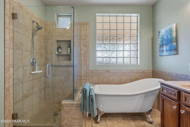1109 N Half Hitch Rd, Prescott Valley, AZ 86314 - full bathroom with a stall shower, plenty of natural light, a freestanding bath, vanity, and tile walls