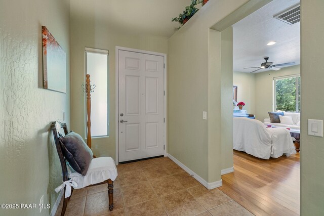1109 N Half Hitch Rd, Prescott Valley, AZ 86314 - entryway featuring a ceiling fan, baseboards, and light tile patterned flooring
