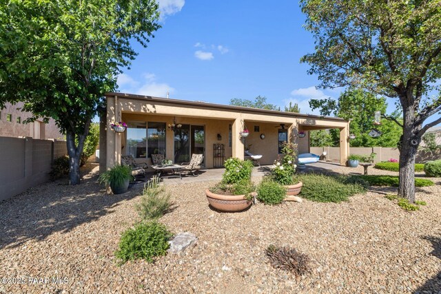 1109 N Half Hitch Rd, Prescott Valley, AZ 86314 - rear view of house featuring a patio and stucco siding