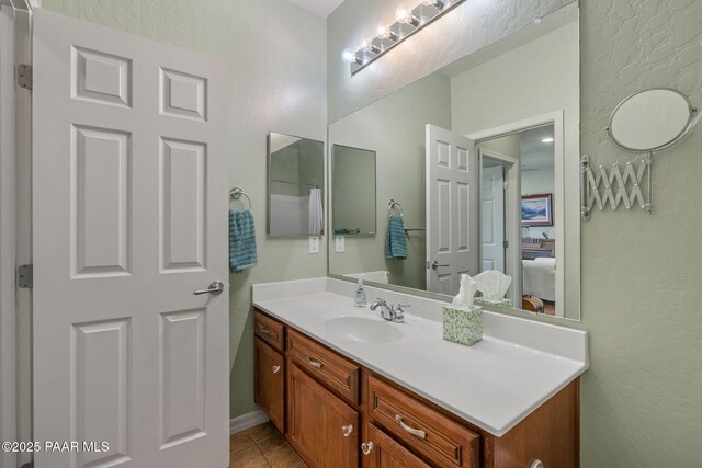 1109 N Half Hitch Rd, Prescott Valley, AZ 86314 - ensuite bathroom with a textured wall, tile patterned flooring, and vanity