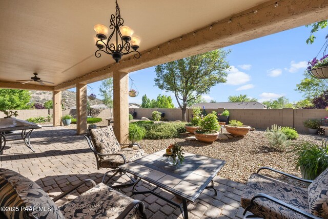 1109 N Half Hitch Rd, Prescott Valley, AZ 86314 - fenced backyard featuring a patio area and a ceiling fan
