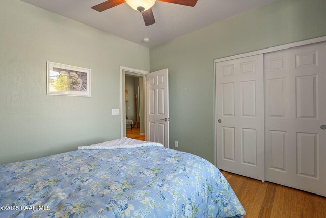 1109 N Half Hitch Rd, Prescott Valley, AZ 86314 - bedroom featuring a ceiling fan, a closet, and light wood-type flooring