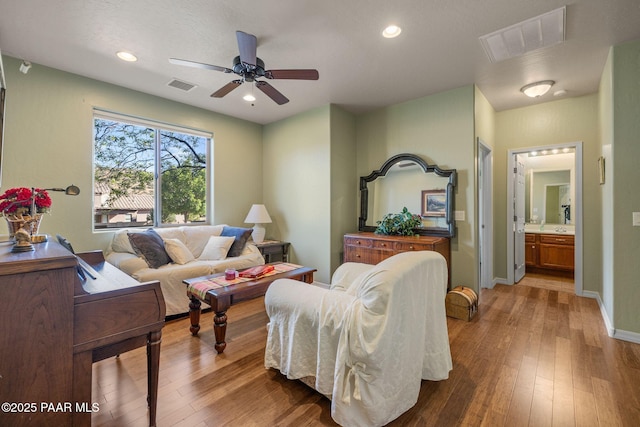 1109 N Half Hitch Rd, Prescott Valley, AZ 86314 - living area with wood-type flooring, a ceiling fan, baseboards, and recessed lighting