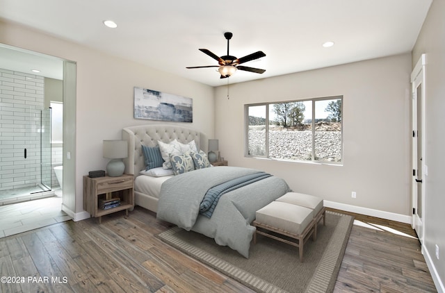 bedroom with dark wood-type flooring, connected bathroom, and ceiling fan