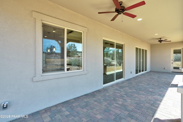 view of patio / terrace featuring ceiling fan