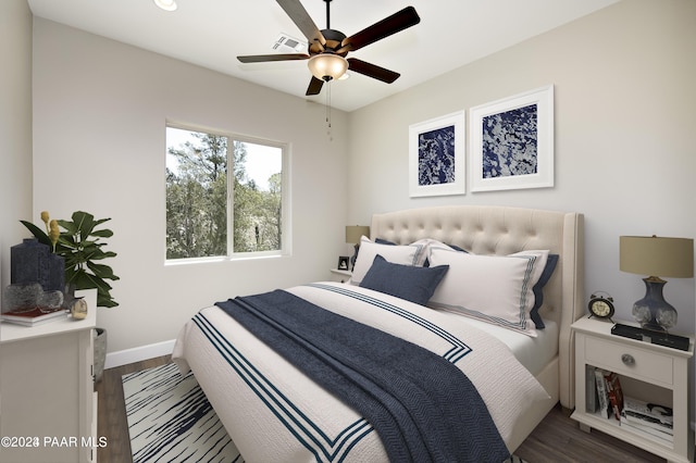 bedroom featuring dark wood-type flooring and ceiling fan