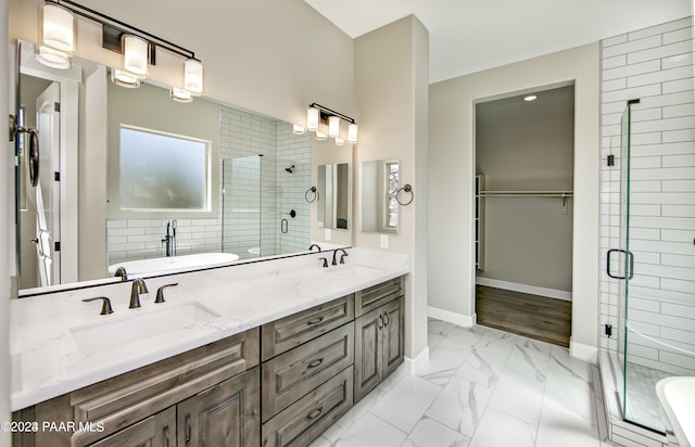 bathroom featuring plus walk in shower and vanity