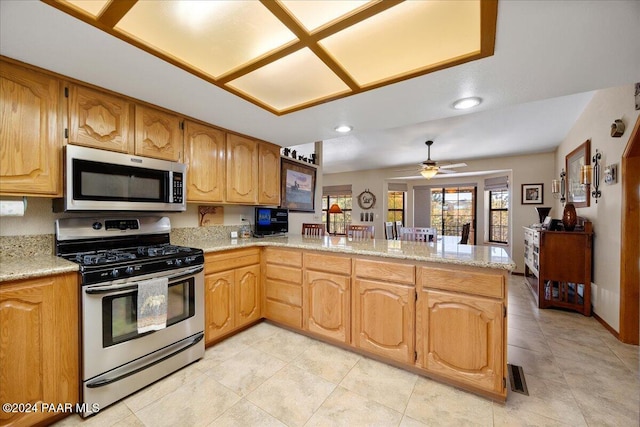 kitchen featuring kitchen peninsula, ceiling fan, and appliances with stainless steel finishes