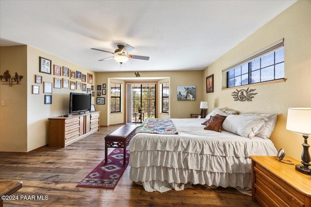 bedroom featuring access to exterior, dark hardwood / wood-style flooring, and ceiling fan