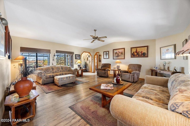 living room with hardwood / wood-style flooring, ceiling fan, and lofted ceiling