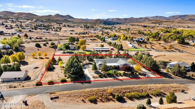 birds eye view of property with a mountain view