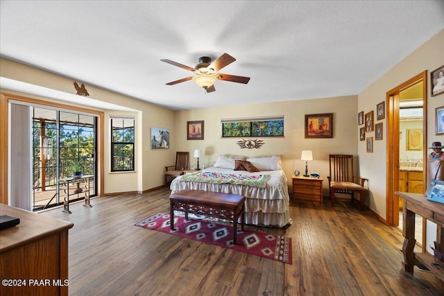 bedroom with a textured ceiling, ceiling fan, and dark hardwood / wood-style floors