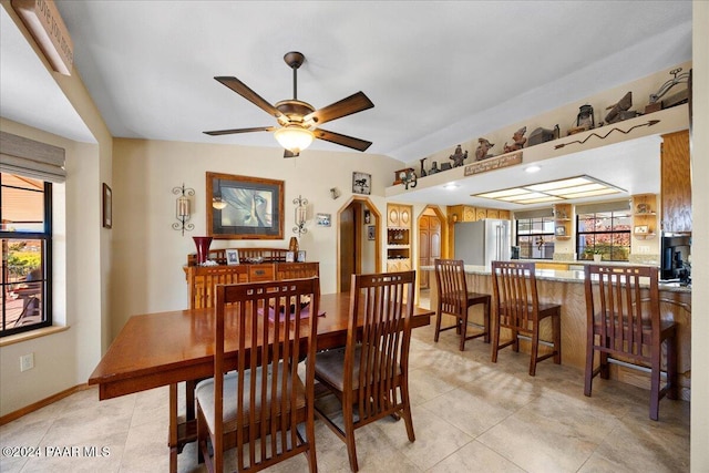 dining room featuring ceiling fan and light tile patterned floors