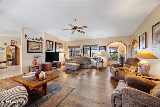 living room with lofted ceiling, ceiling fan, and wood-type flooring