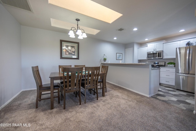 3070 Cascades Ct Unit 14C, Prescott, AZ 86301 - dining area featuring carpet, a chandelier, a skylight, and recessed lighting