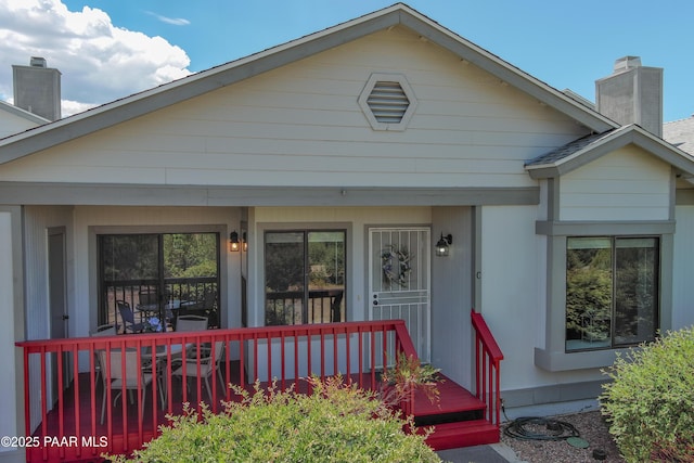 3070 Cascades Ct Unit 14C, Prescott, AZ 86301 - view of front facade featuring a chimney and covered porch