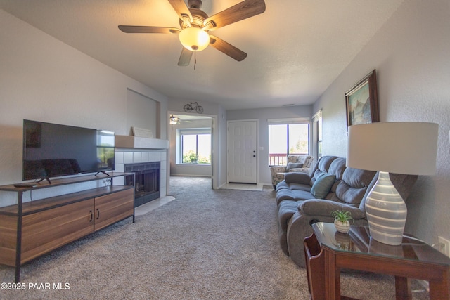 3070 Cascades Ct Unit 14C, Prescott, AZ 86301 - living room with carpet floors, ceiling fan, and a tiled fireplace
