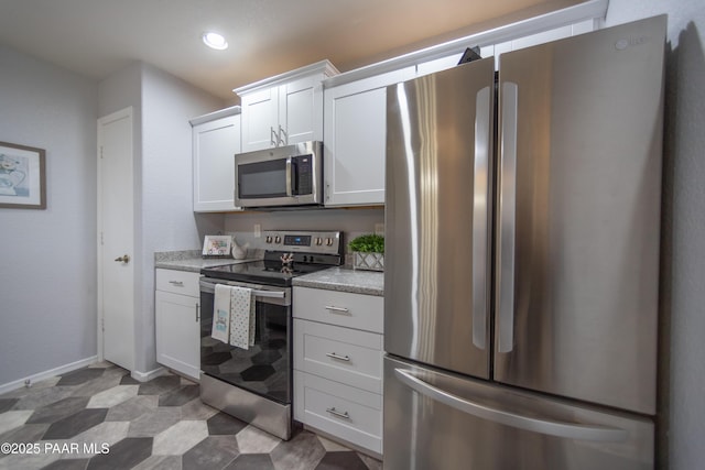 3070 Cascades Ct Unit 14C, Prescott, AZ 86301 - kitchen with appliances with stainless steel finishes, light countertops, white cabinets, and recessed lighting