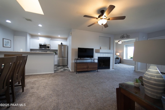 3070 Cascades Ct Unit 14C, Prescott, AZ 86301 - living area with a ceiling fan, carpet flooring, recessed lighting, and a tile fireplace