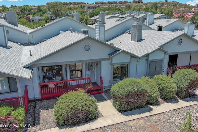 3070 Cascades Ct Unit 14C, Prescott, AZ 86301 - view of front of property featuring a chimney, covered porch, and a residential view
