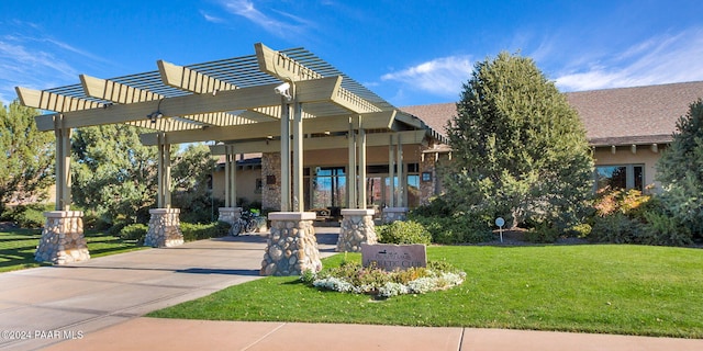 exterior space featuring a lawn and a pergola