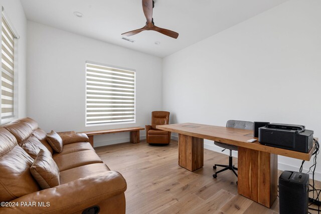 office area with ceiling fan and light hardwood / wood-style flooring