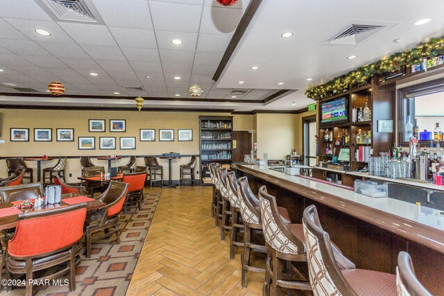 bar with light parquet flooring