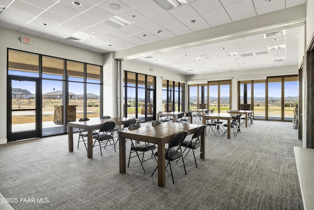 3280 Stone Cliff Ct, Prescott, AZ 86301 - dining room with carpet floors, a paneled ceiling, plenty of natural light, and a mountain view