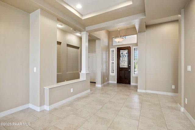 3280 Stone Cliff Ct, Prescott, AZ 86301 - entrance foyer featuring ornate columns, recessed lighting, baseboards, light tile patterned floors, and a tray ceiling