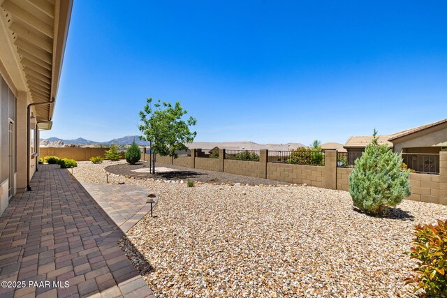 3280 Stone Cliff Ct, Prescott, AZ 86301 - fenced backyard featuring a mountain view and a patio