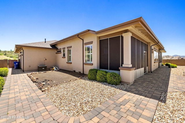3280 Stone Cliff Ct, Prescott, AZ 86301 - back of house with a patio area, a sunroom, and stucco siding