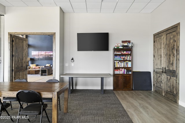 3280 Stone Cliff Ct, Prescott, AZ 86301 - home office with wood finished floors, baseboards, and a paneled ceiling