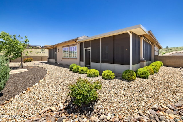 3280 Stone Cliff Ct, Prescott, AZ 86301 - rear view of property featuring a sunroom and a fenced backyard