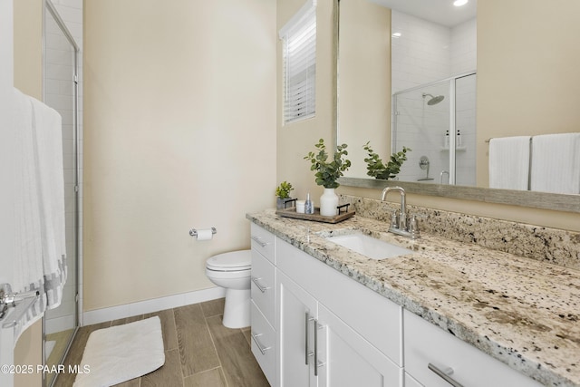 24757 N 175th Dr, Surprise, AZ 85387 - full bathroom featuring vanity, a shower stall, wood tiled floors, and recessed lighting