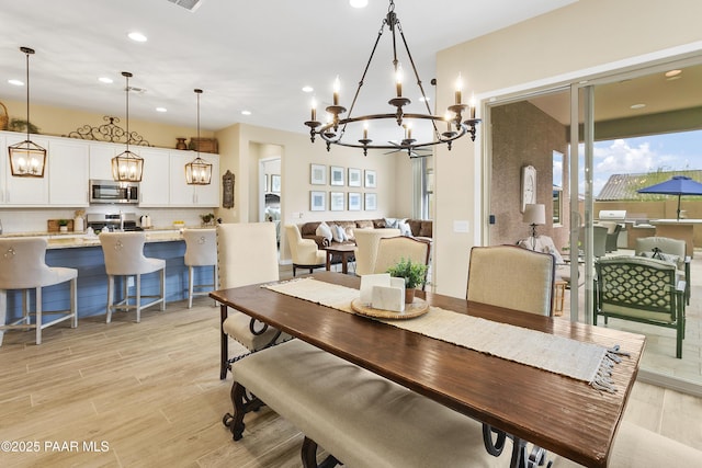 24757 N 175th Dr, Surprise, AZ 85387 - dining room with a chandelier, light wood-style floors, and recessed lighting