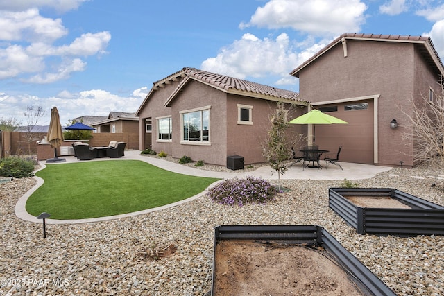 24757 N 175th Dr, Surprise, AZ 85387 - back of house with stucco siding, an outdoor living space, a tiled roof, and a patio