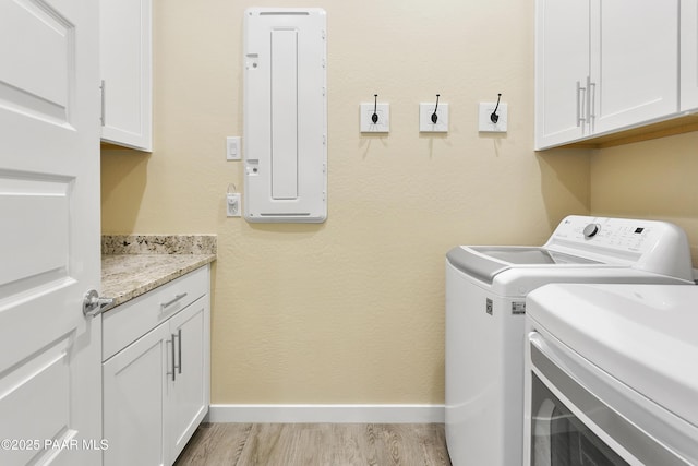 24757 N 175th Dr, Surprise, AZ 85387 - laundry area with washer and dryer, light wood-style flooring, cabinet space, and electric panel