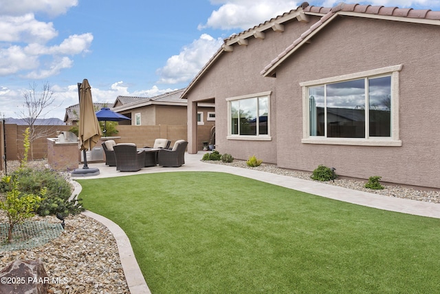 24757 N 175th Dr, Surprise, AZ 85387 - fenced backyard featuring a patio and an outdoor hangout area