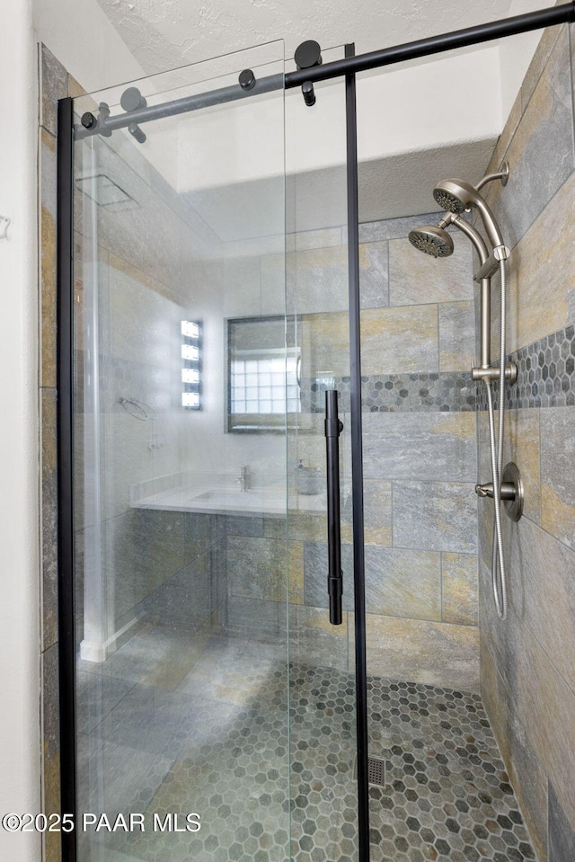 bathroom featuring a shower stall