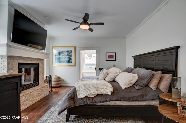 306 S Mt Vernon Ave, Prescott, AZ 86303 - bedroom featuring crown molding, ceiling fan, wood-type flooring, baseboards, and a glass covered fireplace