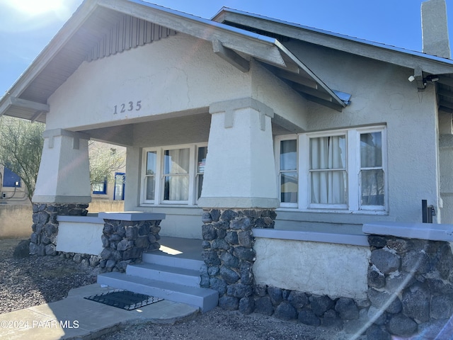 doorway to property with a porch