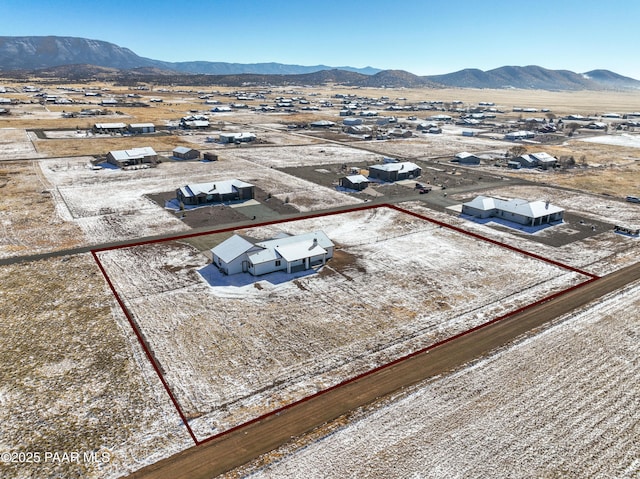 birds eye view of property with a mountain view